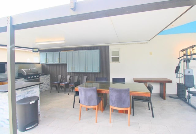 view of patio / terrace with an outdoor kitchen, area for grilling, and outdoor dining space