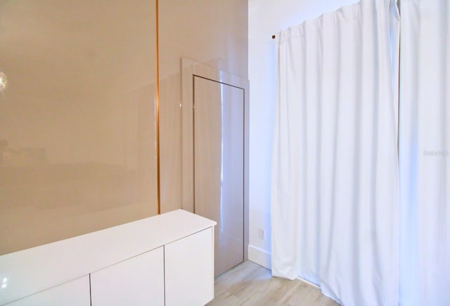 bathroom with wood finished floors