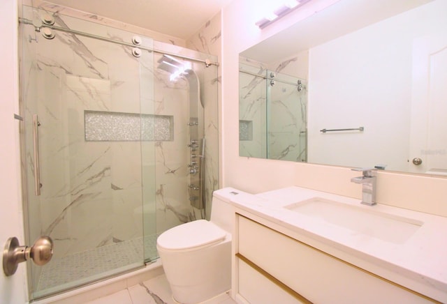 full bathroom with toilet, marble finish floor, a marble finish shower, and vanity