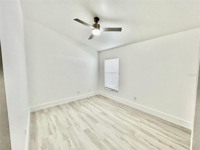 unfurnished room featuring baseboards, ceiling fan, and light wood finished floors