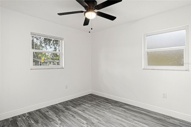 empty room with hardwood / wood-style flooring and ceiling fan