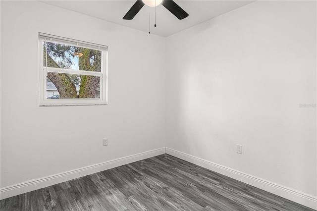 spare room featuring ceiling fan and dark hardwood / wood-style floors