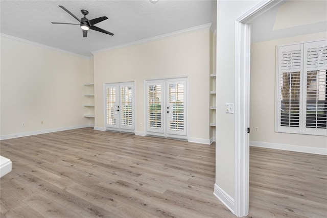 unfurnished living room featuring crown molding, a textured ceiling, french doors, light hardwood / wood-style flooring, and ceiling fan