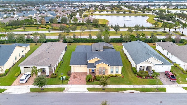 birds eye view of property with a water view