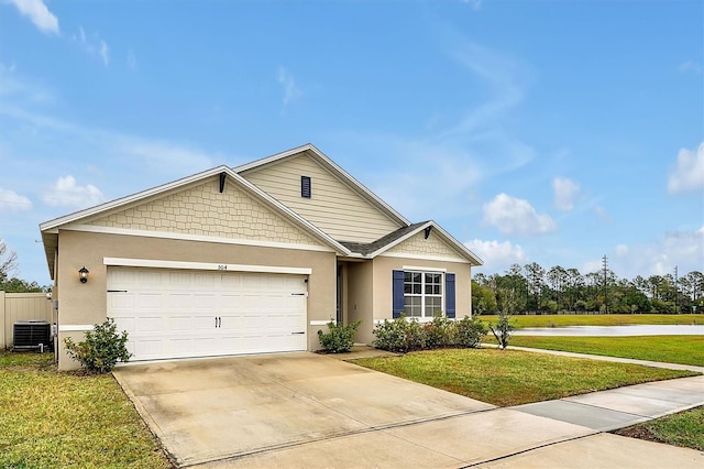 craftsman-style house featuring central AC unit, a garage, and a front yard