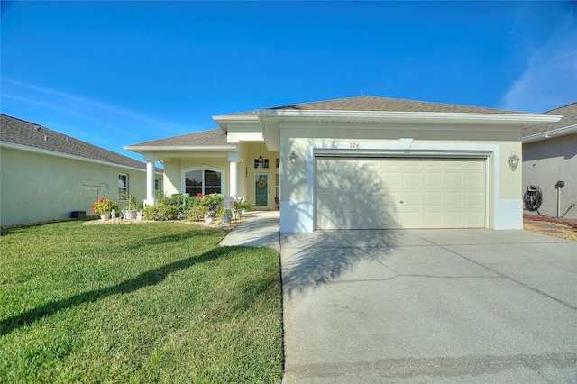 view of front of house with a garage and a front lawn