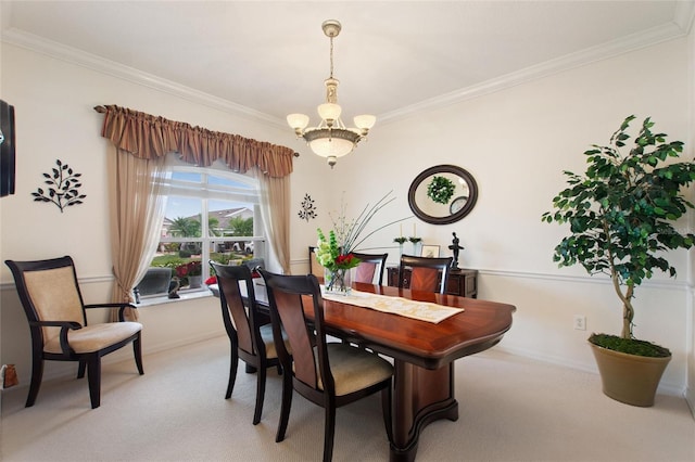 carpeted dining room featuring ornamental molding and a chandelier