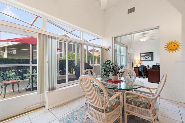 sunroom / solarium with plenty of natural light and ceiling fan