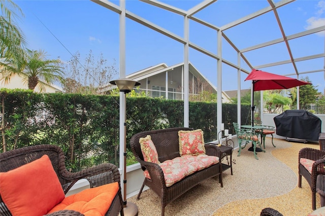 view of patio with a lanai and a grill