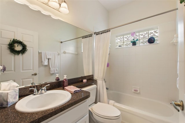 full bathroom featuring vanity, shower / bathtub combination with curtain, and toilet