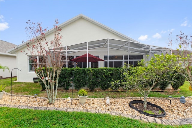 rear view of house with glass enclosure