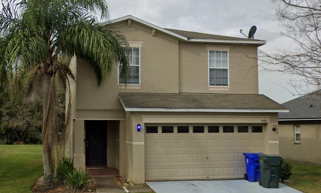 view of front of property with a garage