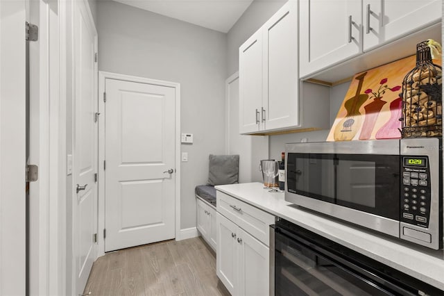 kitchen with white cabinetry and light wood-type flooring