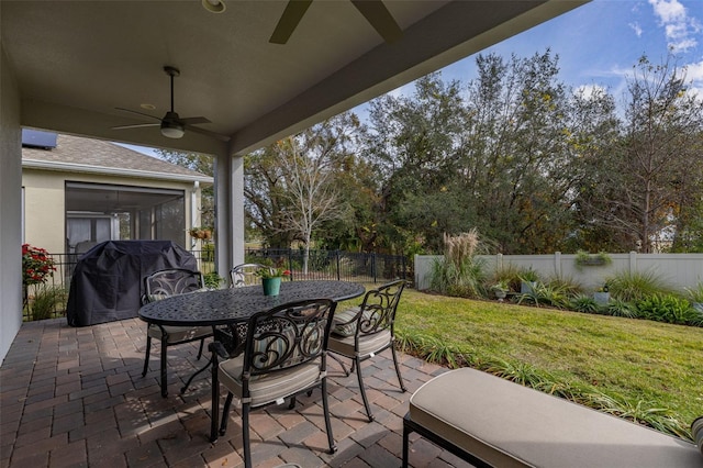 view of patio featuring area for grilling and ceiling fan