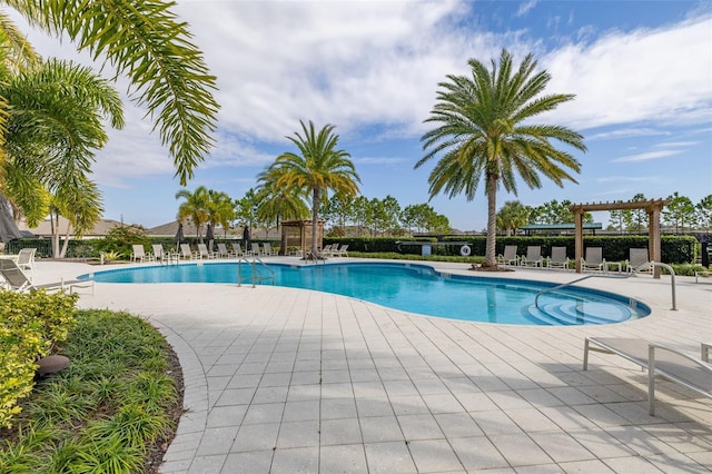 view of swimming pool with a pergola and a patio area