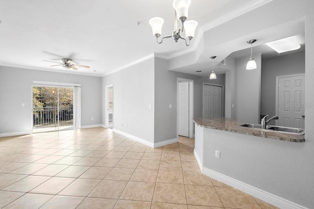 kitchen with ceiling fan with notable chandelier, pendant lighting, sink, ornamental molding, and light tile patterned floors