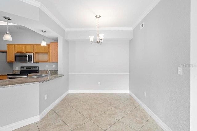 kitchen featuring hanging light fixtures, ornamental molding, appliances with stainless steel finishes, and light tile patterned flooring