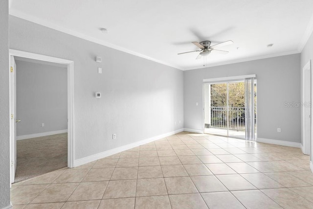 tiled empty room with ceiling fan and crown molding