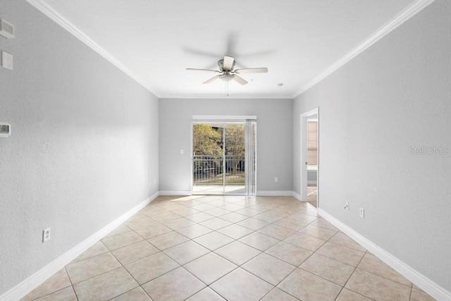 tiled spare room featuring ceiling fan and crown molding