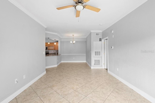 tiled empty room featuring ceiling fan with notable chandelier, sink, and crown molding