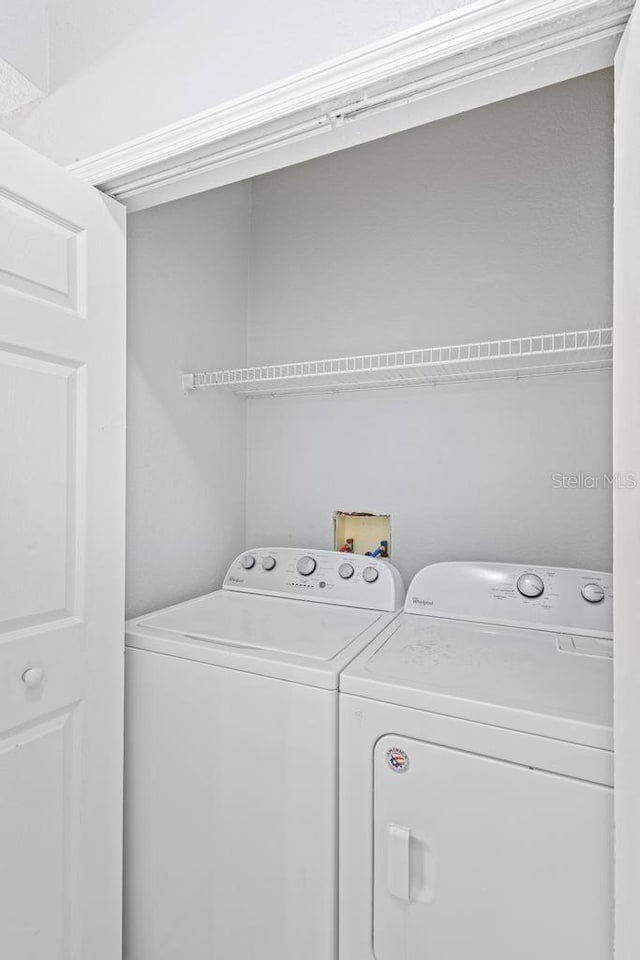 laundry area featuring independent washer and dryer