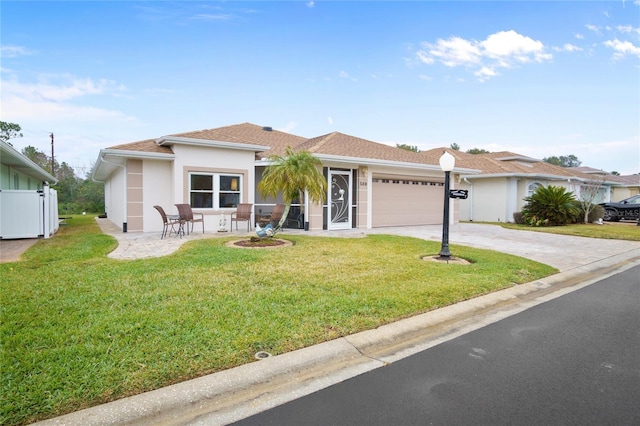 ranch-style house with a garage and a front yard