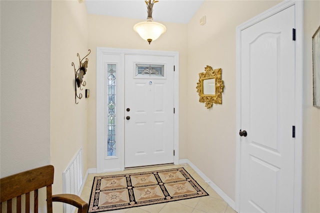 entrance foyer featuring light tile patterned floors