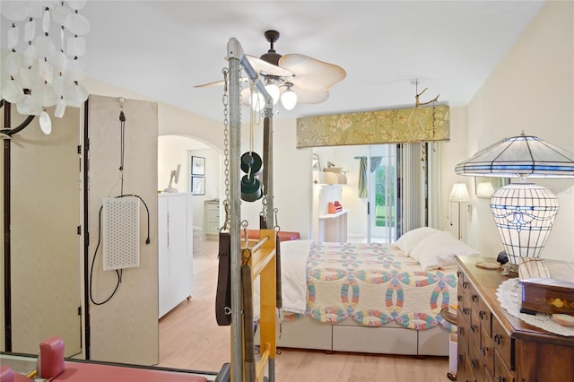 bedroom featuring light hardwood / wood-style floors and ensuite bathroom