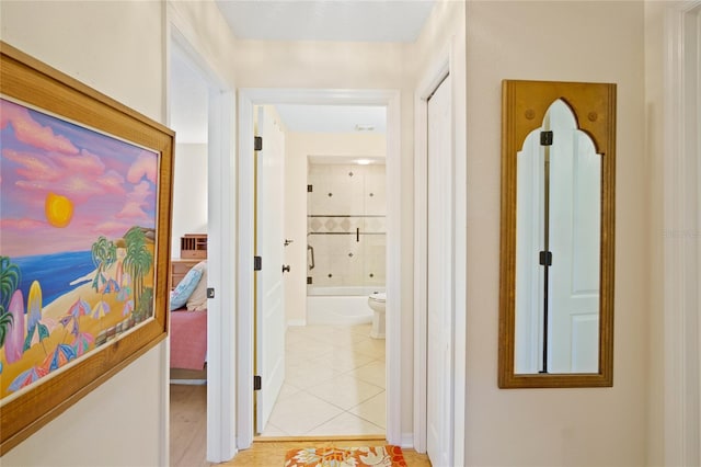 hall featuring light tile patterned flooring