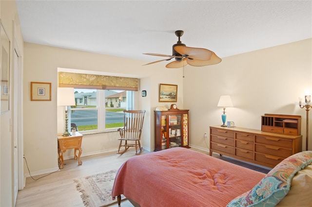 bedroom featuring ceiling fan and light hardwood / wood-style floors