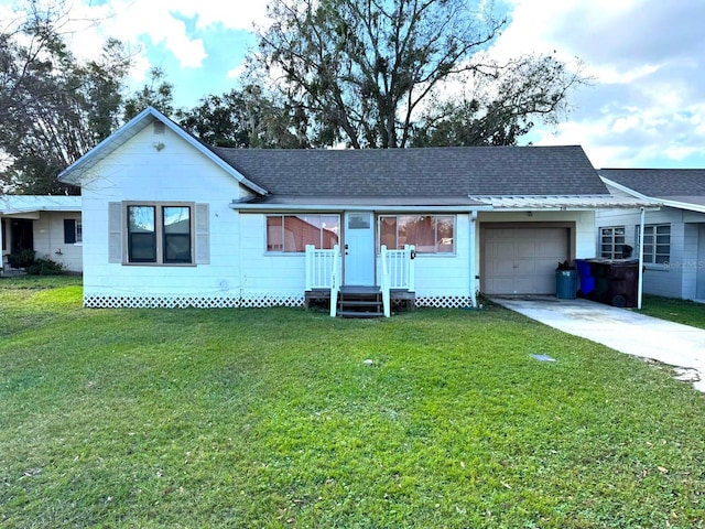 ranch-style home with a garage and a front lawn