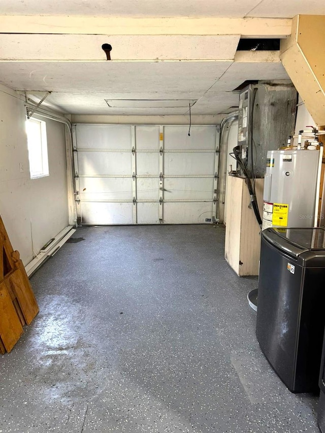 garage featuring washer / clothes dryer and water heater