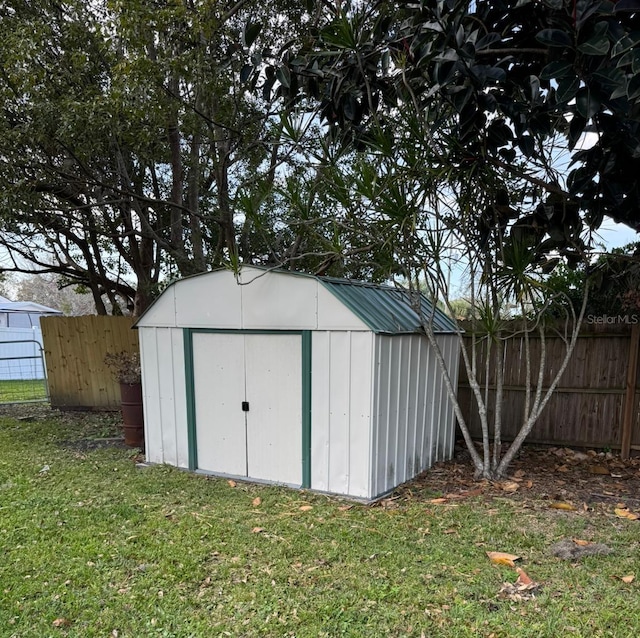 view of outbuilding featuring a yard