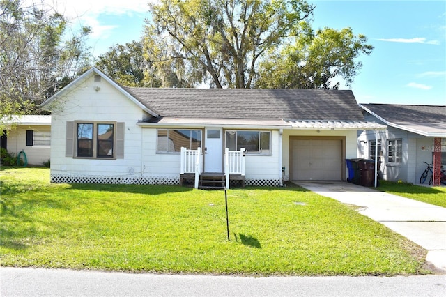 ranch-style house with a shingled roof, concrete driveway, an attached garage, and a front lawn