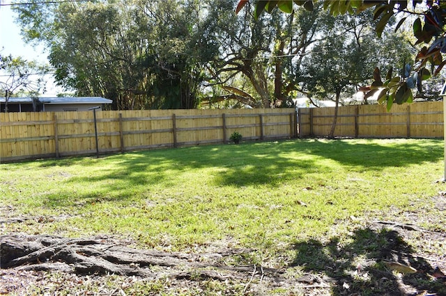 view of yard featuring a fenced backyard