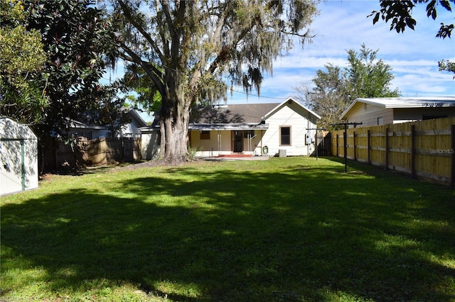 view of yard with a fenced backyard