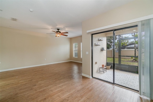 unfurnished room featuring hardwood / wood-style flooring and ceiling fan