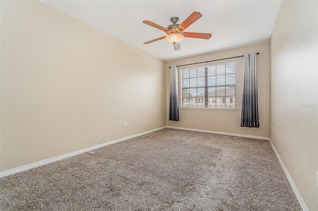 empty room featuring ceiling fan and carpet flooring