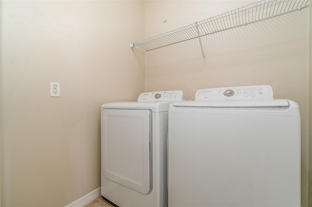 laundry room with independent washer and dryer