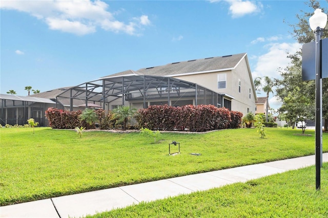 view of property's community with a lawn