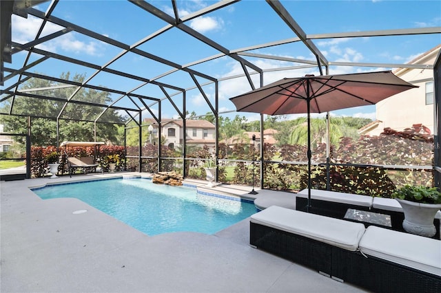 view of swimming pool with a lanai and a patio