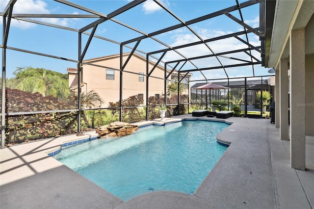 view of pool featuring a lanai and a patio