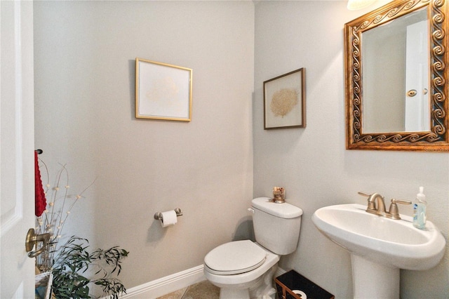 bathroom with sink, tile patterned floors, and toilet