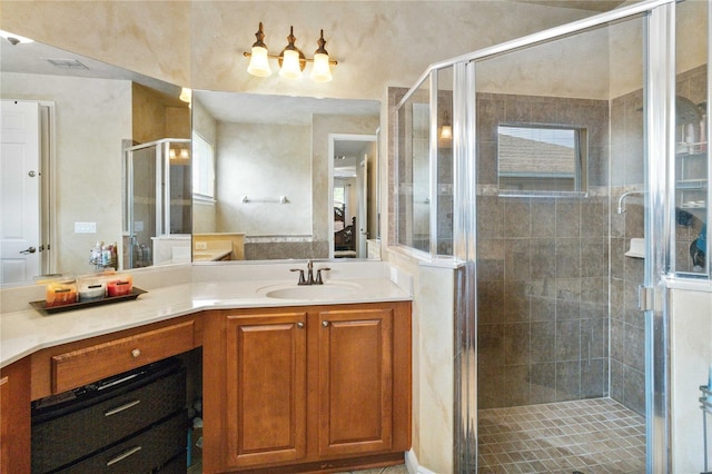 bathroom with vanity and walk in shower