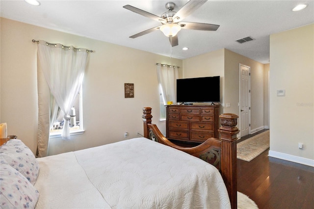 bedroom featuring dark wood-type flooring and ceiling fan