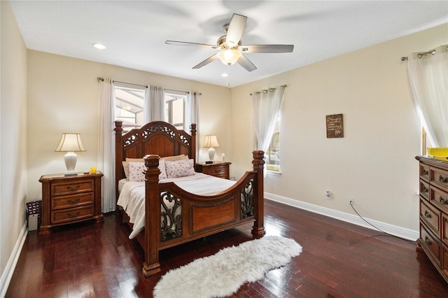 bedroom with ceiling fan and dark hardwood / wood-style flooring