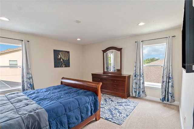 bedroom featuring light colored carpet