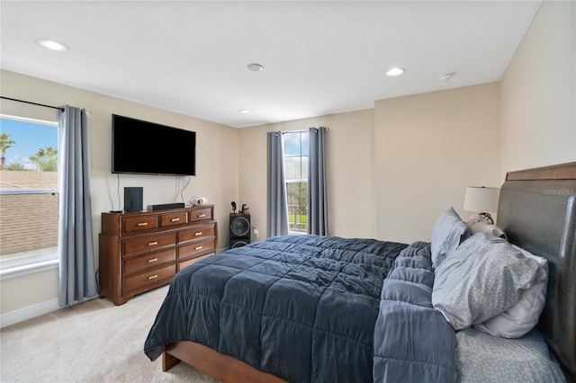 bedroom featuring light colored carpet