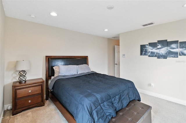 bedroom featuring light carpet