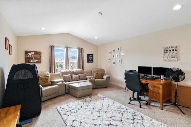 carpeted office space featuring vaulted ceiling